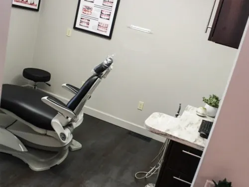 A dental chair in a treatment room at McNeil Dental.